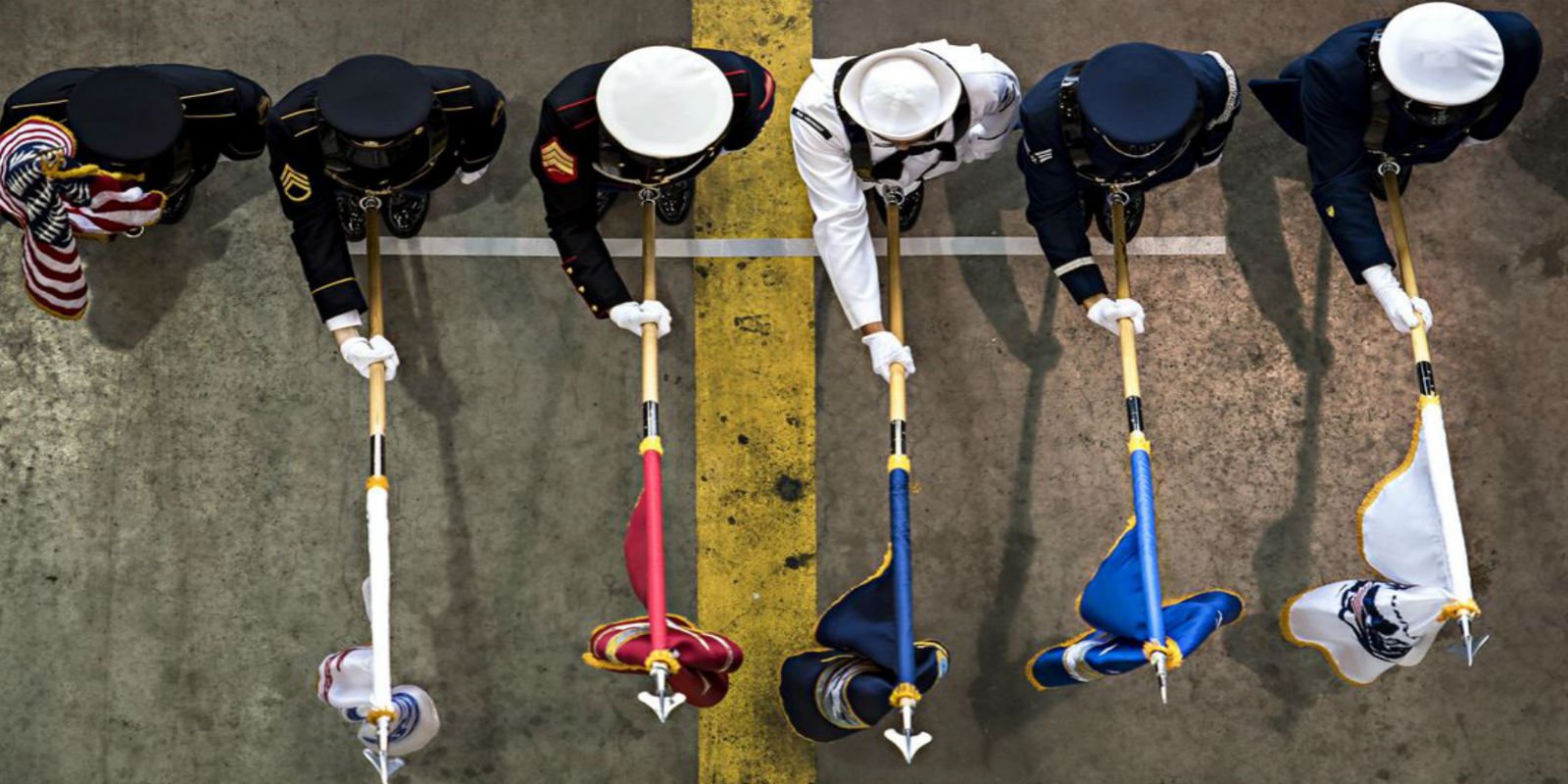 A joint color guard presents U.S. and service flags. Photo by Staff Sgt. Katherine 